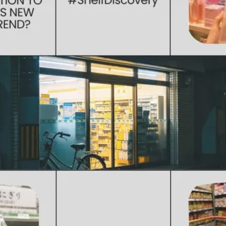 Storefront at night with glass entrance, warm interior lighting, and a bicycle parked outside.