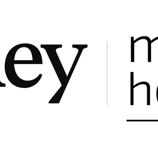 Logo showing the word 'journey' beside 'mastel hospitality' with a gold globe icon at the top right and a dividing line between the names.