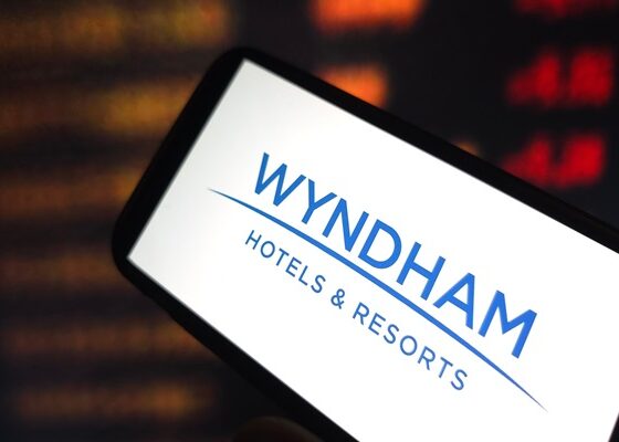 Smartphone screen showing the Wyndham Hotels & Resorts logo in blue on white.