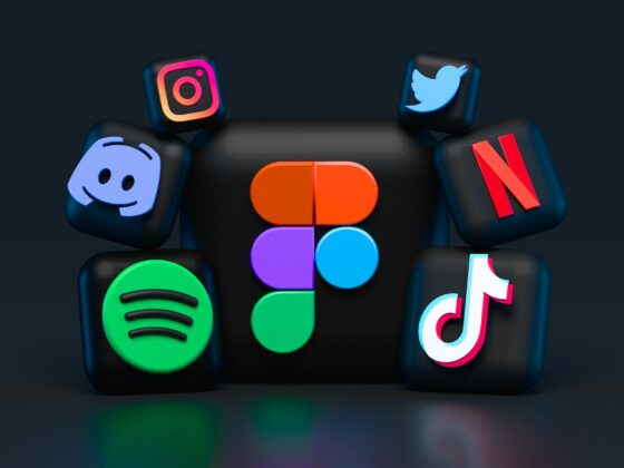 Close-up of glossy 3D app icons (Instagram, Twitter, Netflix, TikTok, Discord, Spotify) on a black cube surface, centered.