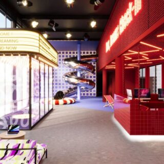 Colorful entertainment center interior with a yellow marquee, neon red bar, glass-walled lounge, and a spiraling slide in the back.