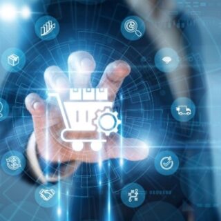 Person in a suit touches a glowing holographic shopping cart with gears, surrounded by digital icons representing e-commerce.
