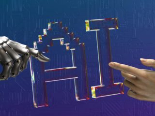 Robotic hand and human hand reaching toward a transparent geometric lattice, symbolizing human–machine collaboration against a blue circuit-board backdrop.