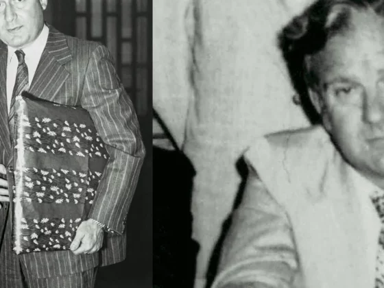 Diptych of two men in suits: left man in a pinstripe suit holding a large patterned book, right man in a light suit looks at the camera (black-and-white).