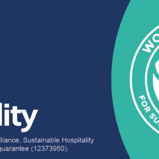 Banner promoting sustainable hospitality branding: World Sustainable Hospitality Alliance with NetPositiveHospitality text and a circular World Academy emblem, plus a call-to-action about a 2-week free trial by email on teal background.