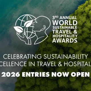 Aerial view of forest meeting the ocean with the World Sustainable Travel & Hospitality Awards logo and the message '2026 entries now open'