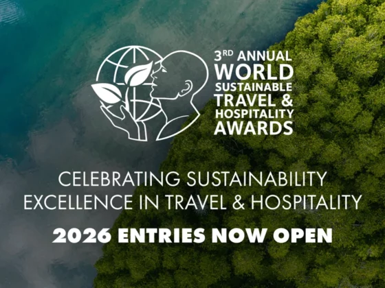 Aerial view of forest meeting the ocean with the World Sustainable Travel & Hospitality Awards logo and the message '2026 entries now open'