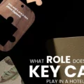 Dark promotional image with scattered hotel key cards and bold white text: 'What role does a key card play in a hotel's identity?'
