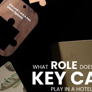 Dark promotional image with scattered hotel key cards and bold white text: 'What role does a key card play in a hotel's identity?'