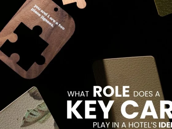 Dark promotional image with scattered hotel key cards and bold white text: 'What role does a key card play in a hotel's identity?'