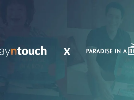 Collaboration banner showing Stayntouch and Paradise in a Box logos with an X between them on a teal background.