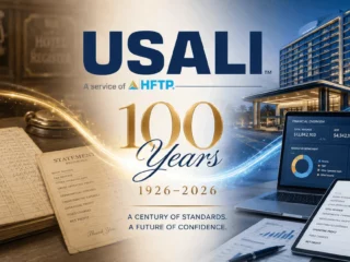 Banner celebrating USALI’s 100th anniversary (1926–2026) with an old ledger, pen, and modern financial dashboards.