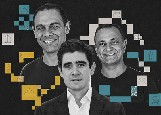 Three men pose for a business banner: two in black shirts in the background and one in a suit in front, with blue, yellow, and white geometric blocks and icons scattered around.
